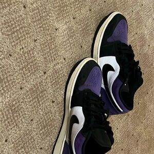 Air Jordans low black purple and white color way for men’s size us 9.5.